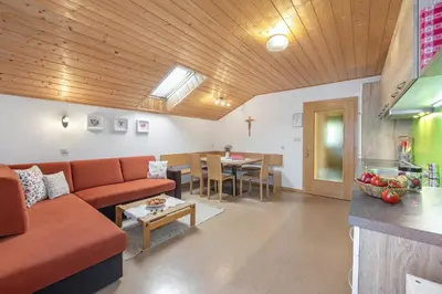 a living room with a couch and a table at Ferienbauernhof Wieserhof in Fiè