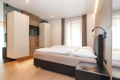 a bedroom with two beds in a room at Gasthof Sonne snc in Sarntal