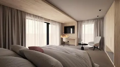 a pair of beds with hearts on the pillows at Hotel COSMEA 4 Stars - Your Dolomites experience in Ortisei