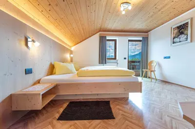 a bedroom with a bed and a wooden ceiling at Agriturismo Al Cir in San Martino in Badia