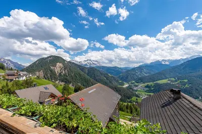 a view of a valley with mountains and houses at Agriturismo Al Cir in San Martino in Badia