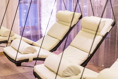 a group of chairs in a room at Hotel Sigmunderhof in Chienes