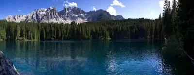 a view of a lake with a mountain in the background at NRH Laurin Karersee in Nova Levante