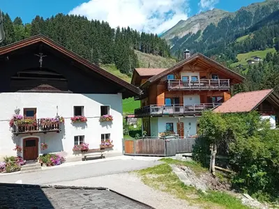 a couple of buildings with flowers on the balconies at Ober-Gruberhof in Ridanna