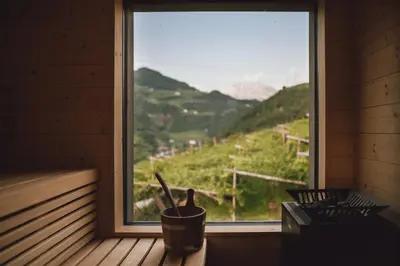 a window with a view of a mountain view at Pitzner - Winery & Suites in Cornedo all'Isarco