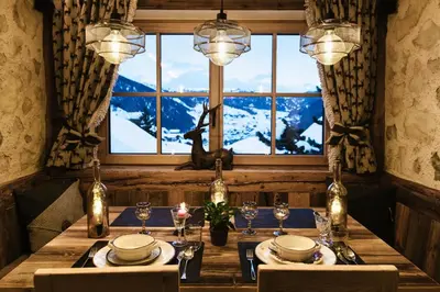 a dining room with a table and a window at Garni Fany in Colfosco