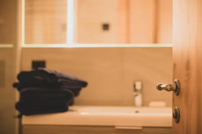 a bathroom with a sink and towels on a counter at Karlshütte in Avelengo
