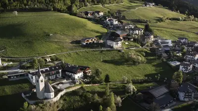 an aerial view of a small village on a hill at Kierhof Chalets in Velturno