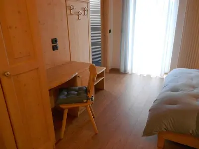 a room with a bed and a kitchen with a table at Apartment in NOVELLA 41460 in Brez