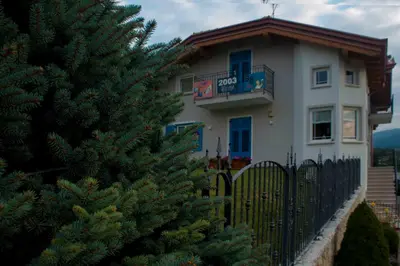 a house with a yard with purple flowers at Apartment in NOVELLA 41460 in Brez