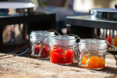a group of jars of food sitting on a table at B&B Unterhabsbergerhof in Appiano sulla Strada del Vino