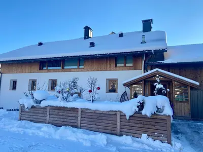 a house covered in snow with a fence at Ban Hilba in Falzes