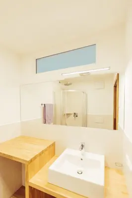 a bathroom with a sink and a mirror at Ferienwohnung Pension Stern in Aldino