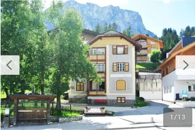 a large house with a fence in front of it at vedla posta in Badia