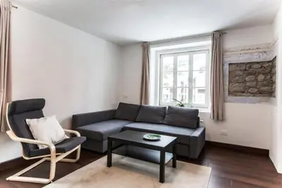 a living room with a couch and a chair at vedla posta in Badia