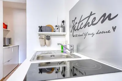 a kitchen with a sink and a counter top at HOMESTWENTY3 - Home five in Caldaro