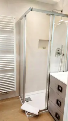 a shower with a glass door in a bathroom at MAISON MY LIFE in Bolzano