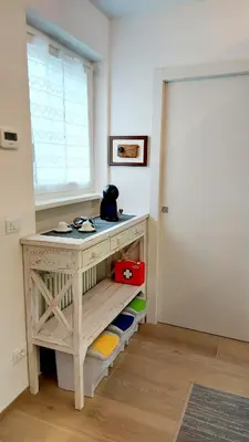 a room with a wooden desk and a window at MAISON MY LIFE in Bolzano