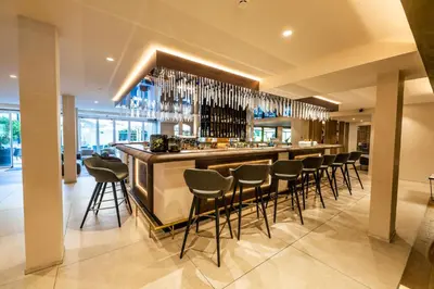 a bar in a restaurant with stools at Tyrol family retreat in Naturno