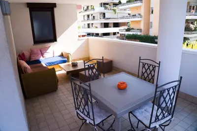 an apartment balcony with a table with a pumpkin on it at Casa Margherita in Bolzano