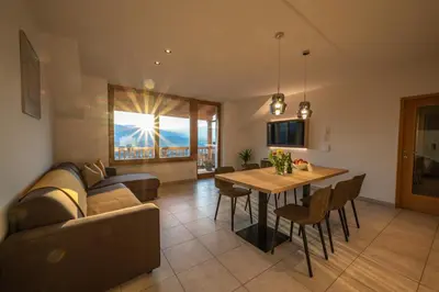 a living room with a couch and a table at Weingut Lahn zu Eppan in Appiano sulla Strada del Vino