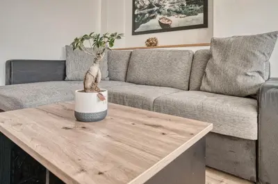 a bedroom with a large bed with white sheets and pillows at byRosi Apartments in Parcines