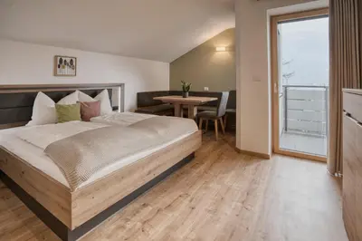 a living room with a couch and a table at byRosi Apartments in Parcines