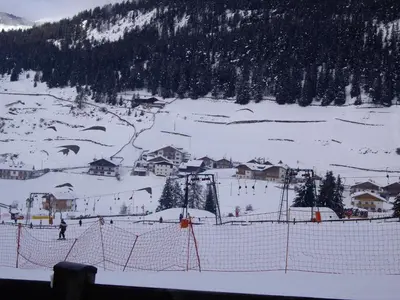 a group of people skiing on a snow covered mountain at Apartments Sunela in Selva di Val Gardena