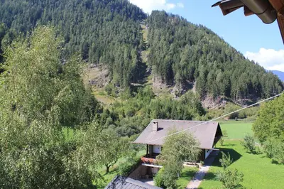 a house in the middle of a mountain at Gasthof Bundschen in Sarntal