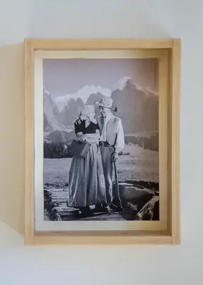 a picture of a man and a woman in a picture frame at Residence Villa Schlern in Fiè