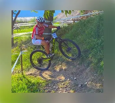 a person riding a bike on a dirt trail at Hotel Garni Christin in Ora/Auer