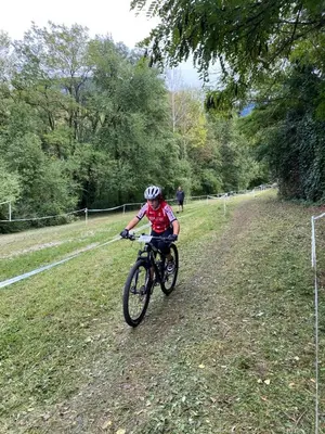 a person riding a bike on a dirt road at Hotel Garni Christin in Ora/Auer