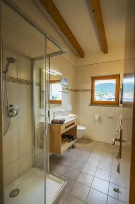 a bathroom with a shower and a sink at Residence Sonneckhof in Caldaro