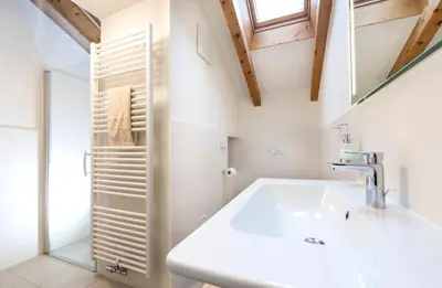 a bathroom with a sink and a shower at Residence Sonneckhof in Caldaro