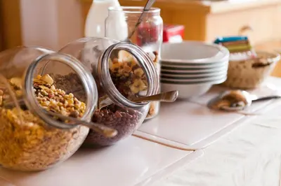 two containers filled with food sitting on a table at Gasthaus Abram in Ora/Auer
