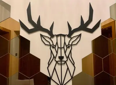 a metal reindeer head on a wall at Casa di Franz in Vigo di Fassa
