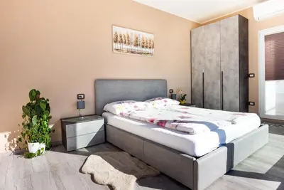 a bedroom with a large bed in a room at Dolce Vista in Merano