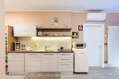 a kitchen with a refrigerator and a sink at Dolce Vista in Merano