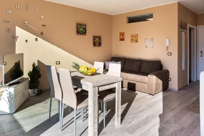 a living room with a table and a couch at Dolce Vista in Merano