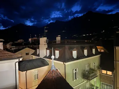 a view of the roof of a building at night at Dolce Vista in Merano
