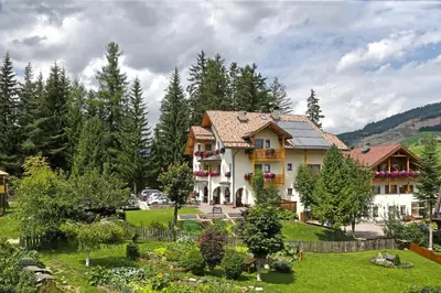 a large house with a garden in a park at Apartments Lasteis in La Villa