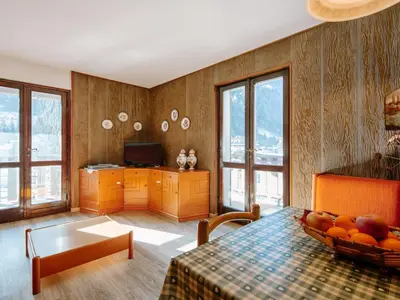 a living room with a couch and a table at Apartment Condominio al Parco-9 by Interhome in Canazei