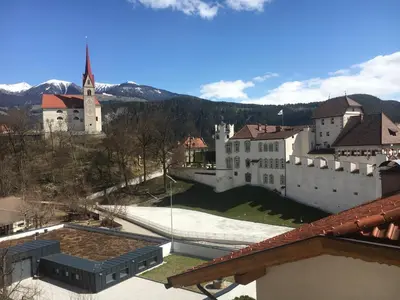 a view of a town with a castle and a church at Apartment Schifta in Chienes