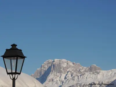 a street light in front of a mountain at Cesa al Monech in Selva di Cadore