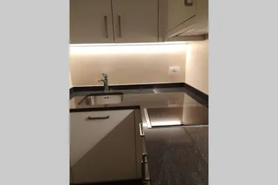a kitchen with a sink and a counter top at Appartment Barbara in Bolzano