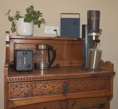 a wooden table with a coffee maker and a blender at CityChalet romantic Bozen in Bolzano