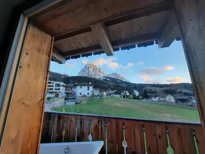 a view from the balcony of a house with a mountain view at Luxury Apartment Daema in Selva di Val Gardena