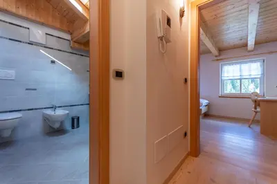 a bathroom with a toilet and a sink at Chalet Butterfly 1 in Mazzin