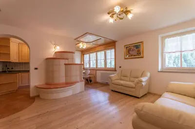 a large living room with a couch and a table at Chalet Butterfly 1 in Mazzin