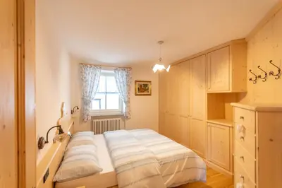a bedroom with a bed and a window at Chalet Butterfly 2 in Mazzin